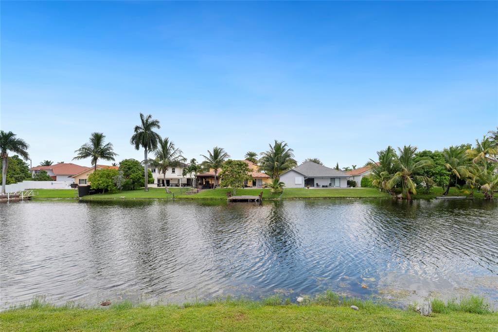 11843 Southwest 13th Court Pembroke Pines, FL 33025 - Photo 29 of 37 a view of a lake with houses