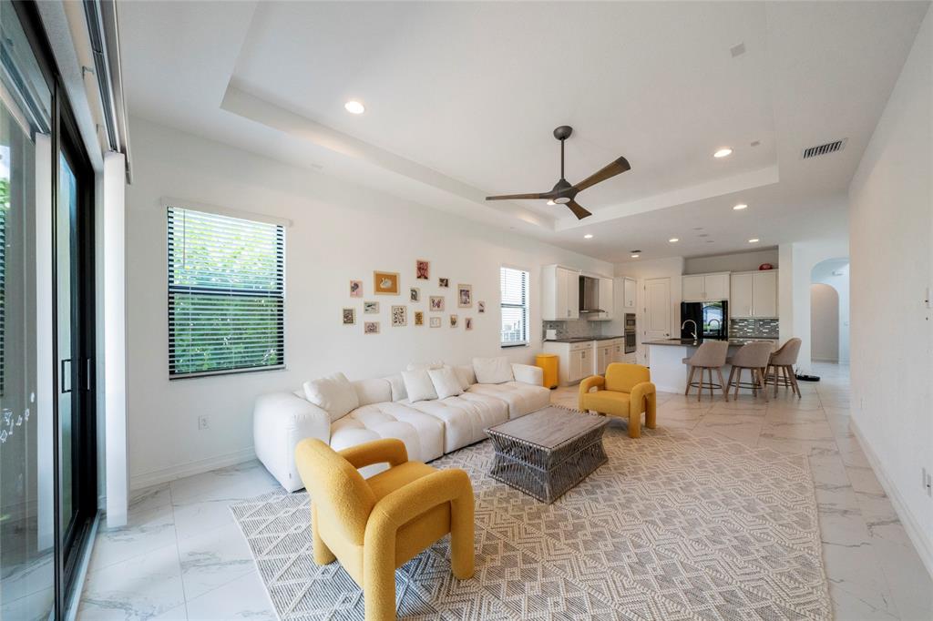 11843 Southwest 13th Court Pembroke Pines, FL 33025 - Photo 7 of 37 a living room with furniture and a window