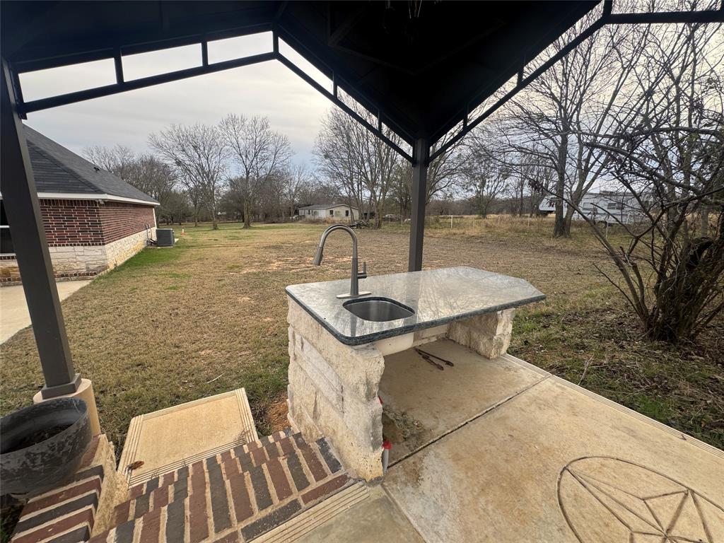 28296 Spring Valley Drive Kemp, TX 75143 - Photo 11 of 32 View of patio / terrace featuring a sink