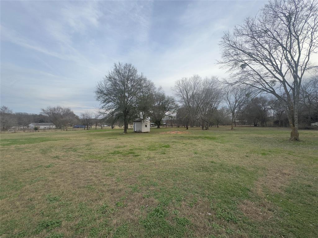 28296 Spring Valley Drive Kemp, TX 75143 - Photo 27 of 32 View of grassy yard with a storage shed and a rural view