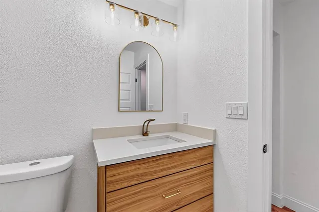 a bathroom with a sink and a toilet