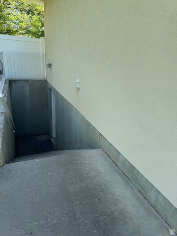 1976 River Bottom Road Springville, UT 84663 - Photo 45 of 45 Exterior stucco wall with concrete foundation and a descending concrete stairway
