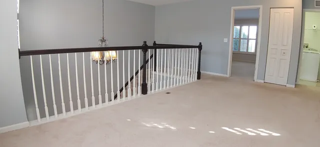 a view of a hallway with windows