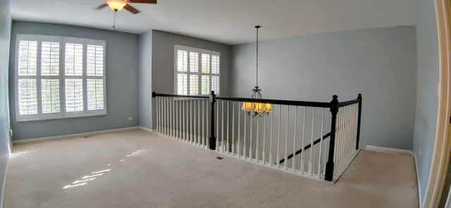 a view of a hallway with windows