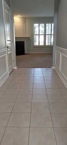 a view of a lake with houses in the background