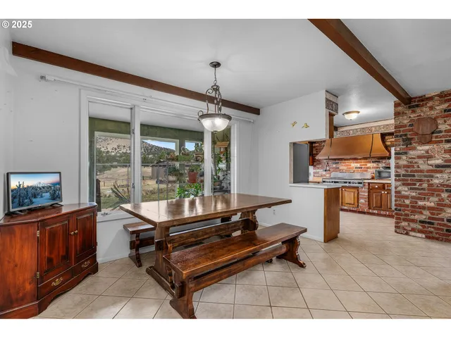 a room with furniture pool table and flat screen tv