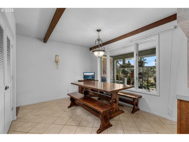 a living room with furniture a window and a table