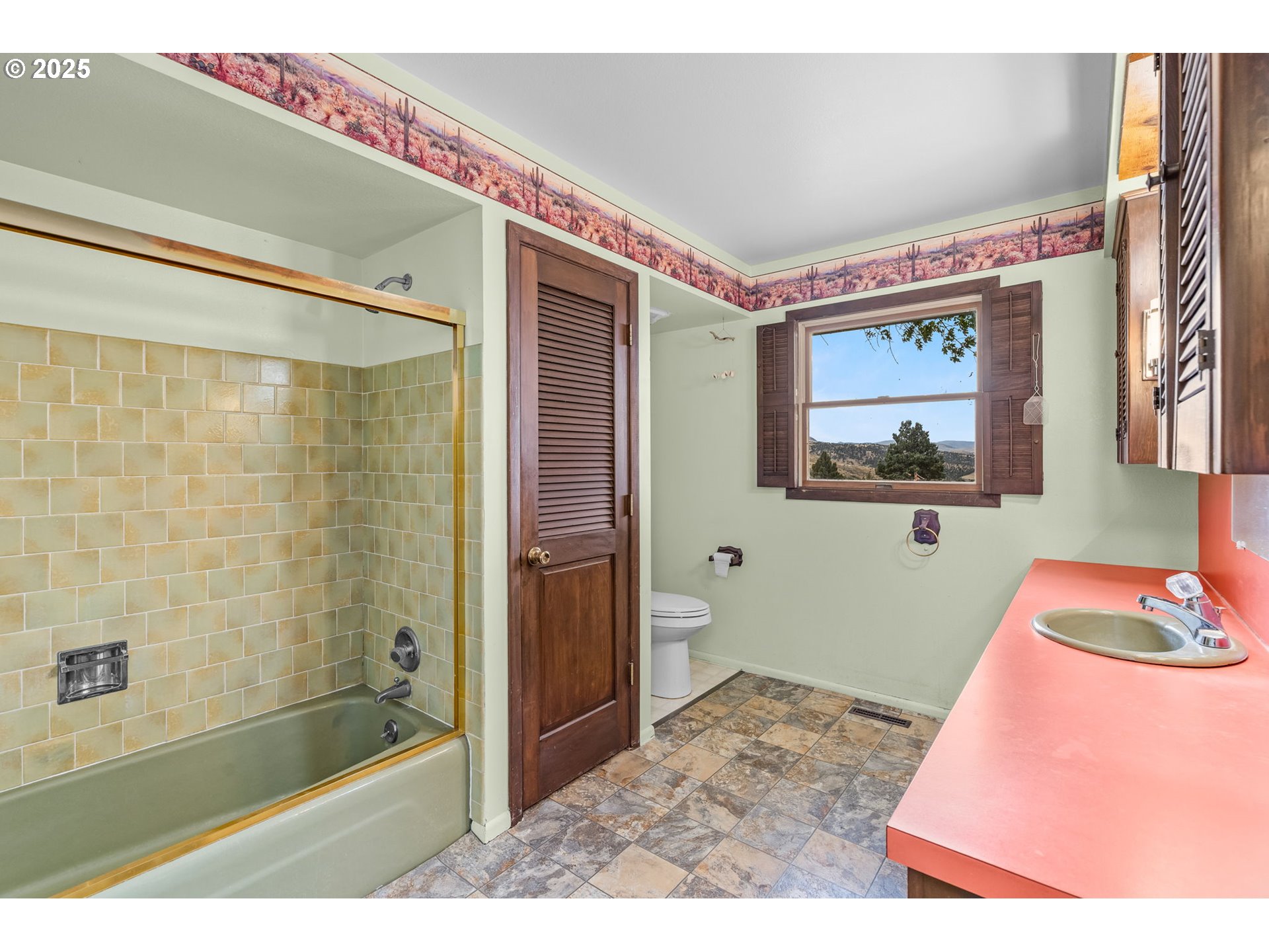 19369 Highway 26 Mitchell, OR 97750 - Photo 23 of 48 a bathroom with a bathtub and a shower