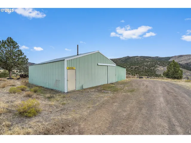 a view of a house with a yard and garage