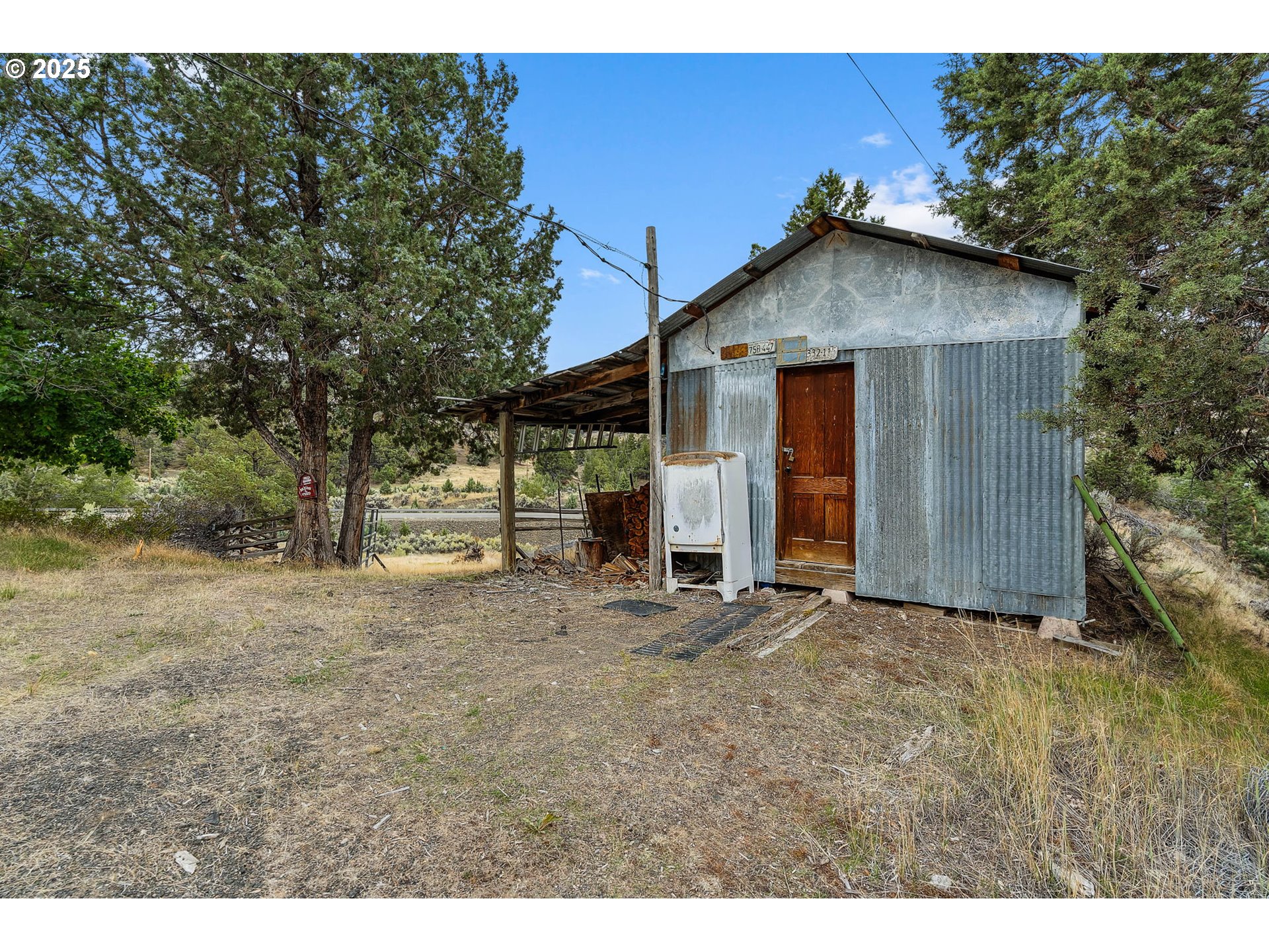 19369 Highway 26 Mitchell, OR 97750 - Photo 42 of 48 a wooden house with trees in the background