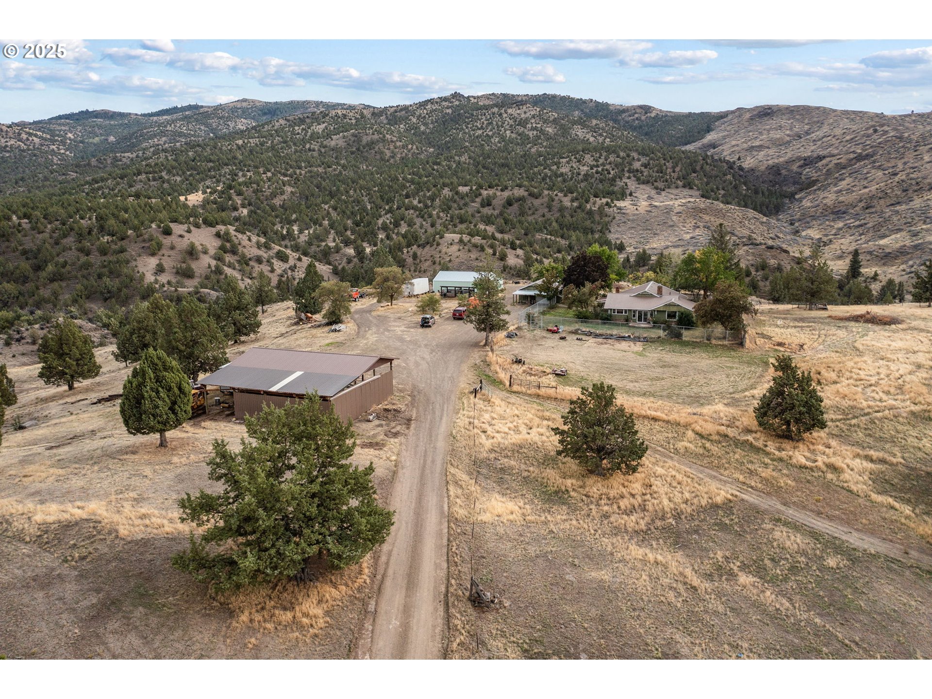 19369 Highway 26 Mitchell, OR 97750 - Photo 43 of 48 a view of a town with mountains in the background