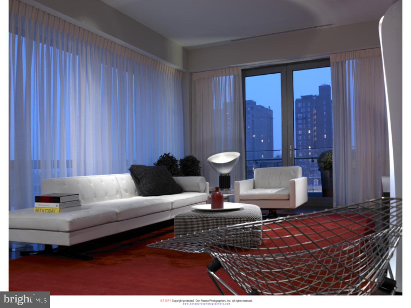 1706 Rittenhouse Square, Unit 402 Philadelphia, PA 19103 - Photo 11 of 17 a living room with furniture and a large window