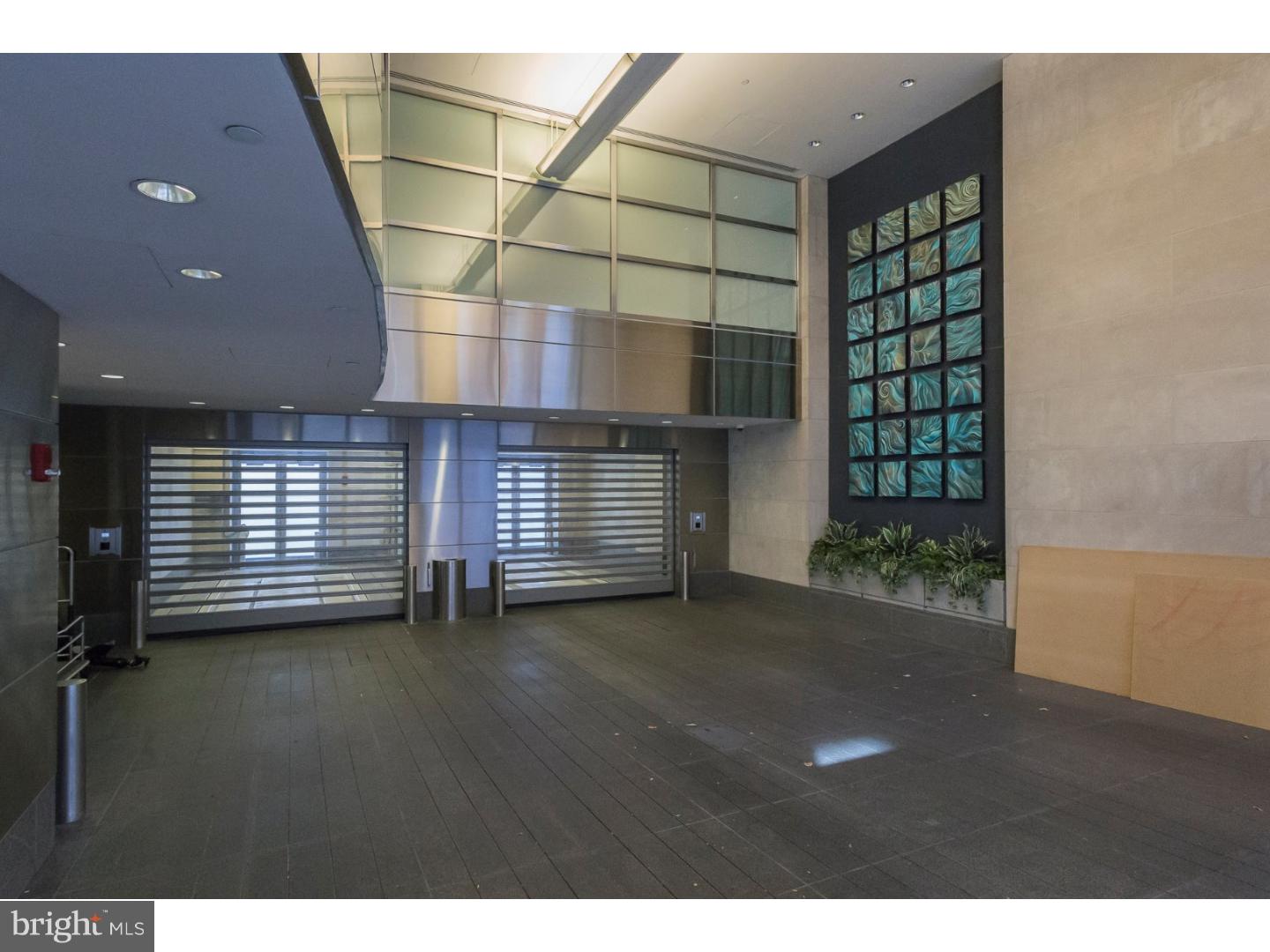 1706 Rittenhouse Square, Unit 402 Philadelphia, PA 19103 - Photo 4 of 17 a view of an empty room with a fireplace and a window