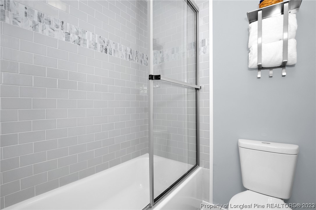 1163 Hoke Loop Road Fayetteville, NC 28314 - Photo 24 of 34 a bathroom with a toilet and shower