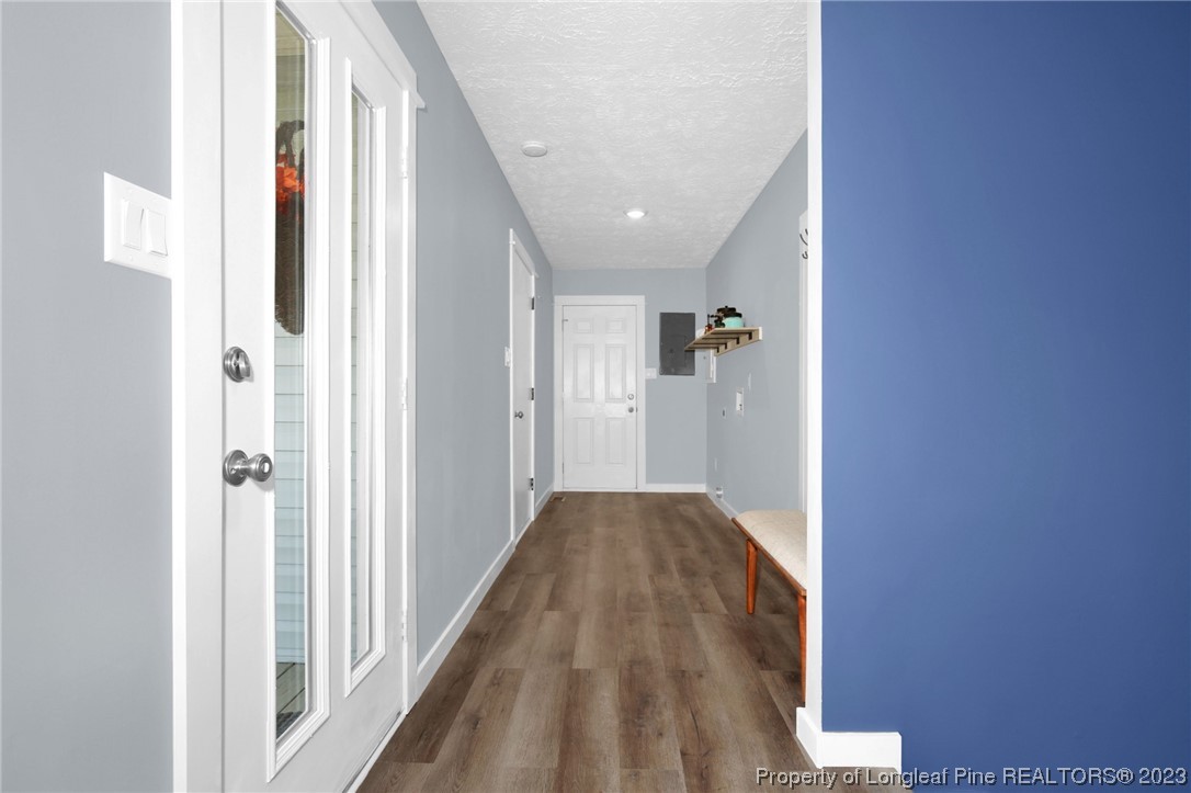 1163 Hoke Loop Road Fayetteville, NC 28314 - Photo 5 of 34 a view of a hallway with wooden floor and entryway