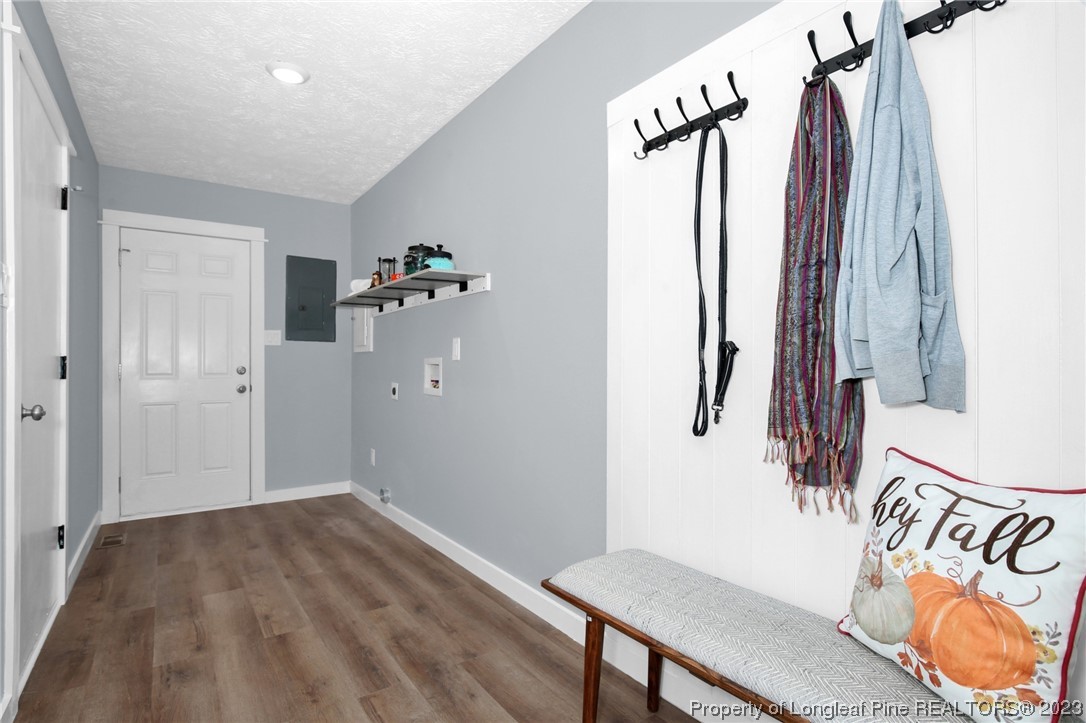 1163 Hoke Loop Road Fayetteville, NC 28314 - Photo 6 of 34 a view of a hallway with wooden floor and stairs