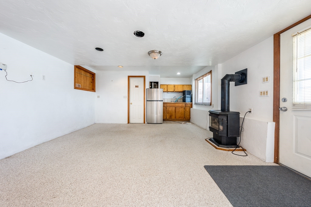 25 Nautical Way, Unit E Bourne, MA 02532 - Photo 15 of 25 a view of a livingroom with furniture and a flat screen tv