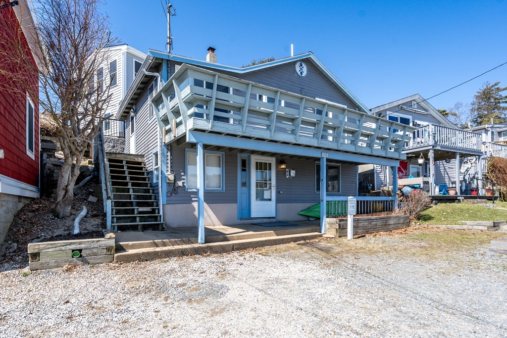 25 Nautical Way, Unit E Bourne, MA 02532 - Photo 22 of 25 a front view of a house with garden