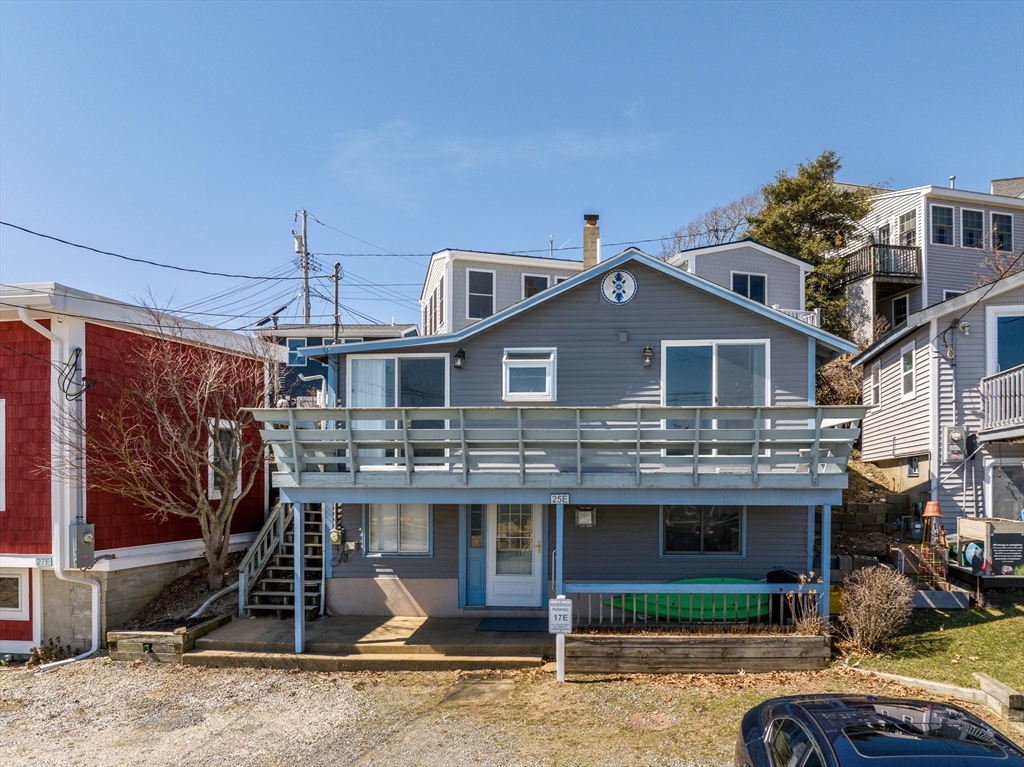25 Nautical Way, Unit E Bourne, MA 02532 - Photo 5 of 25 a front view of a house with a yard