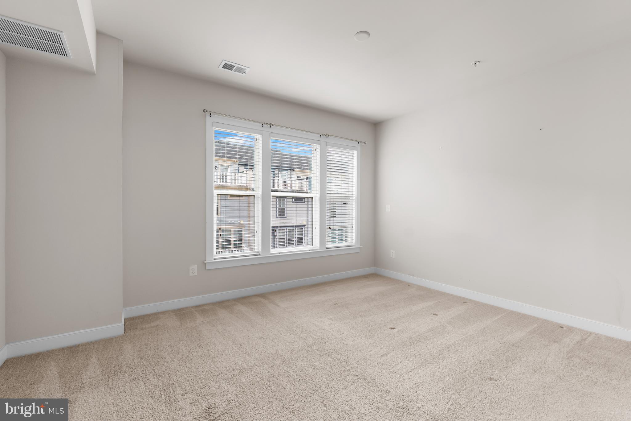 9780 Fields Road Gaithersburg, MD 20878 - Photo 13 of 37 an empty room with a window