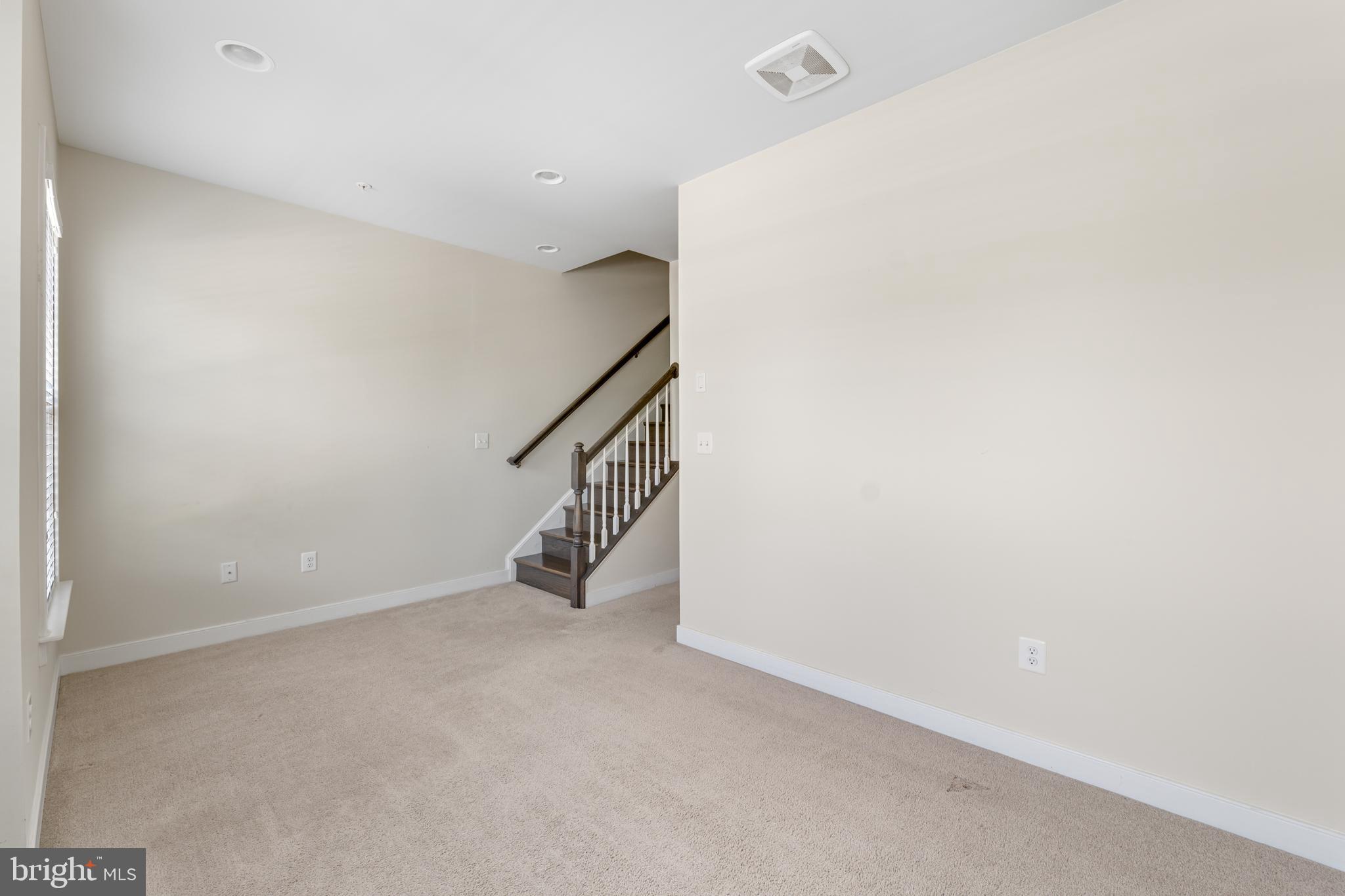 9780 Fields Road Gaithersburg, MD 20878 - Photo 21 of 37 a view of an empty room with stairs