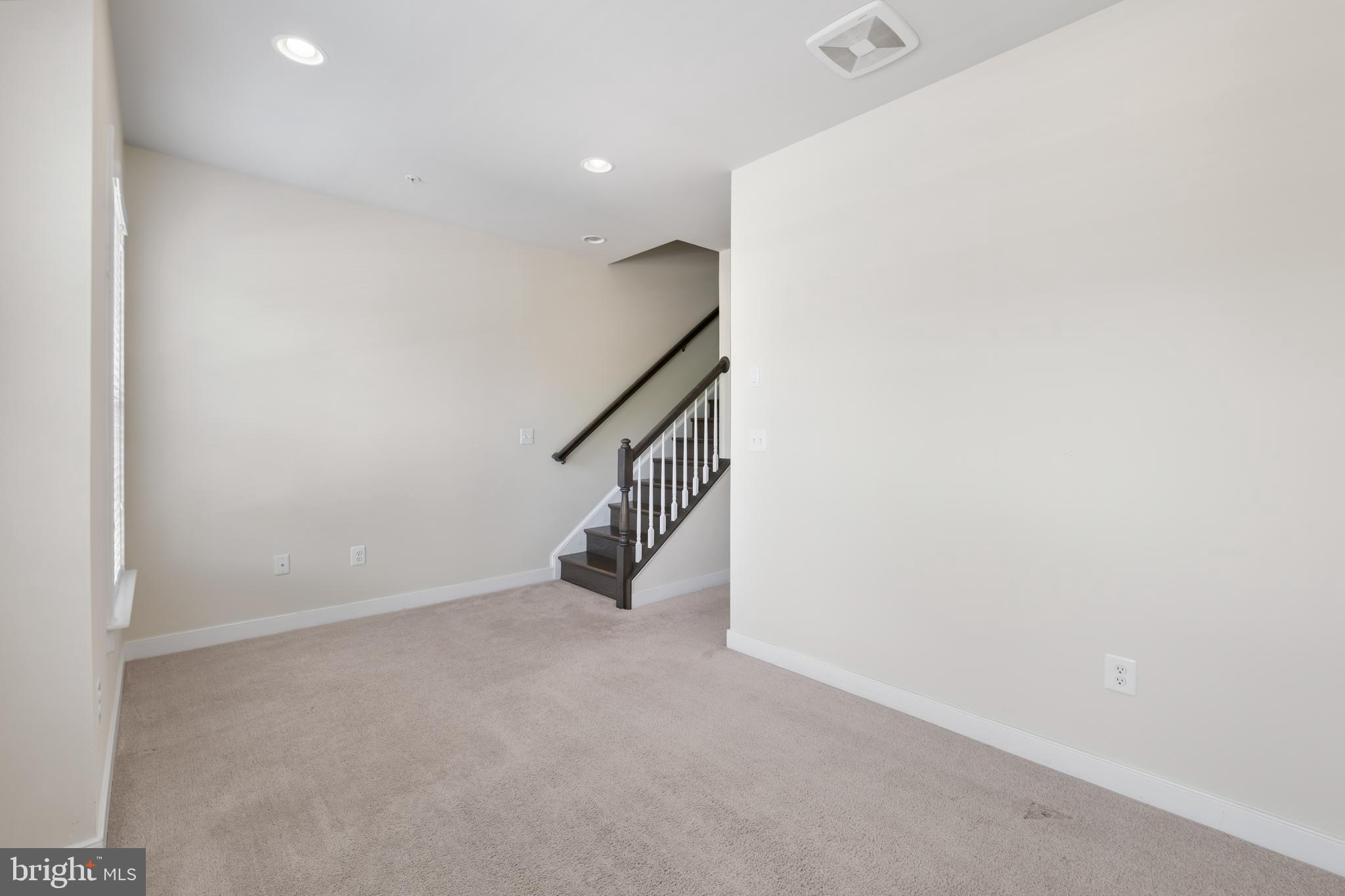 9780 Fields Road Gaithersburg, MD 20878 - Photo 23 of 37 a view of an empty room with stairs