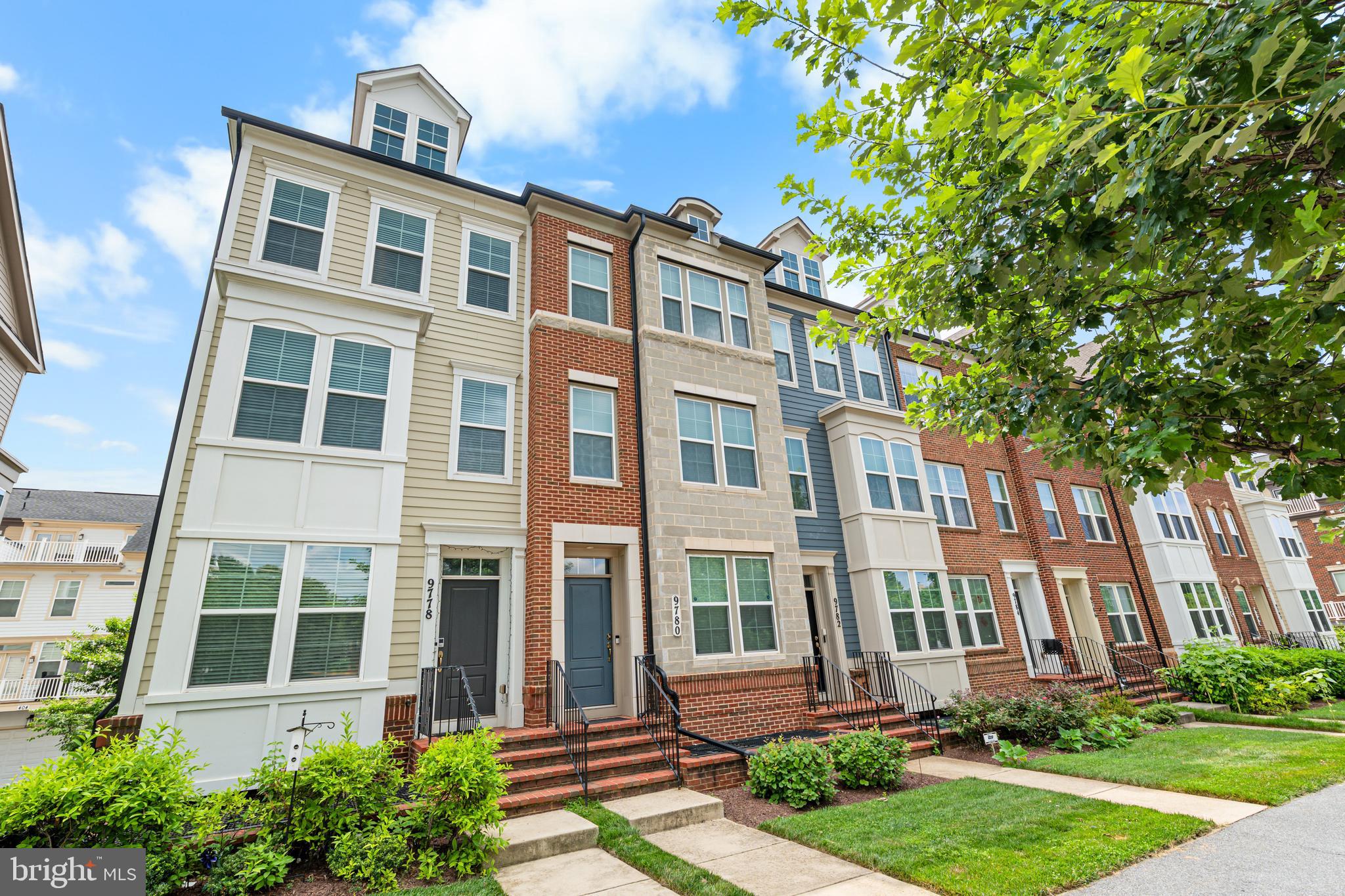 9780 Fields Road Gaithersburg, MD 20878 - Photo 3 of 37 a front view of a building with garden