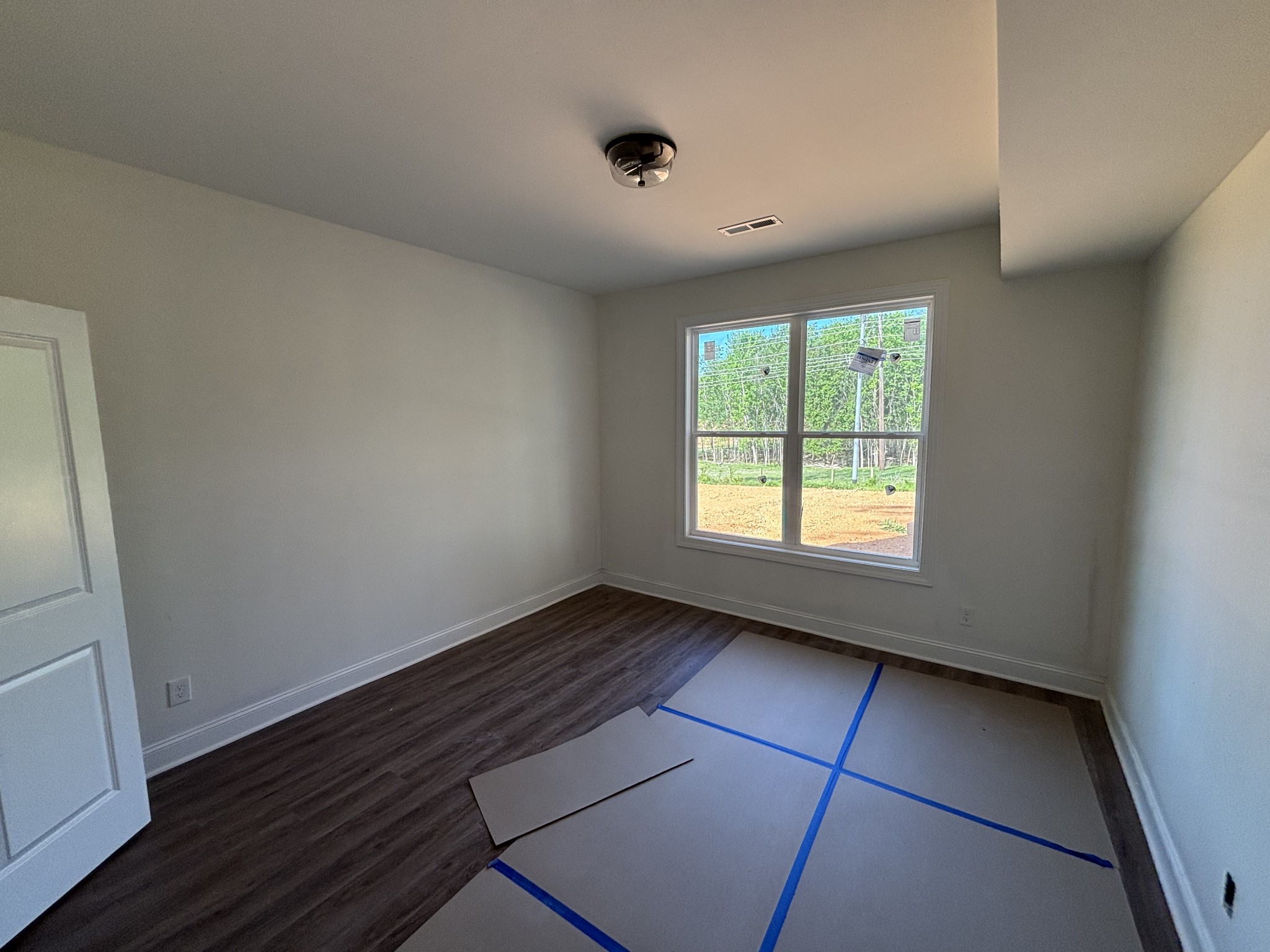 0 Cascade Drive Winchester, TN 37398 - Photo 25 of 33 an empty room with wooden floor and windows