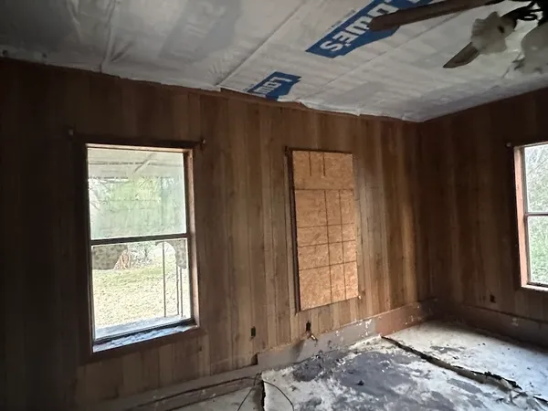 a view of a bedroom with windows