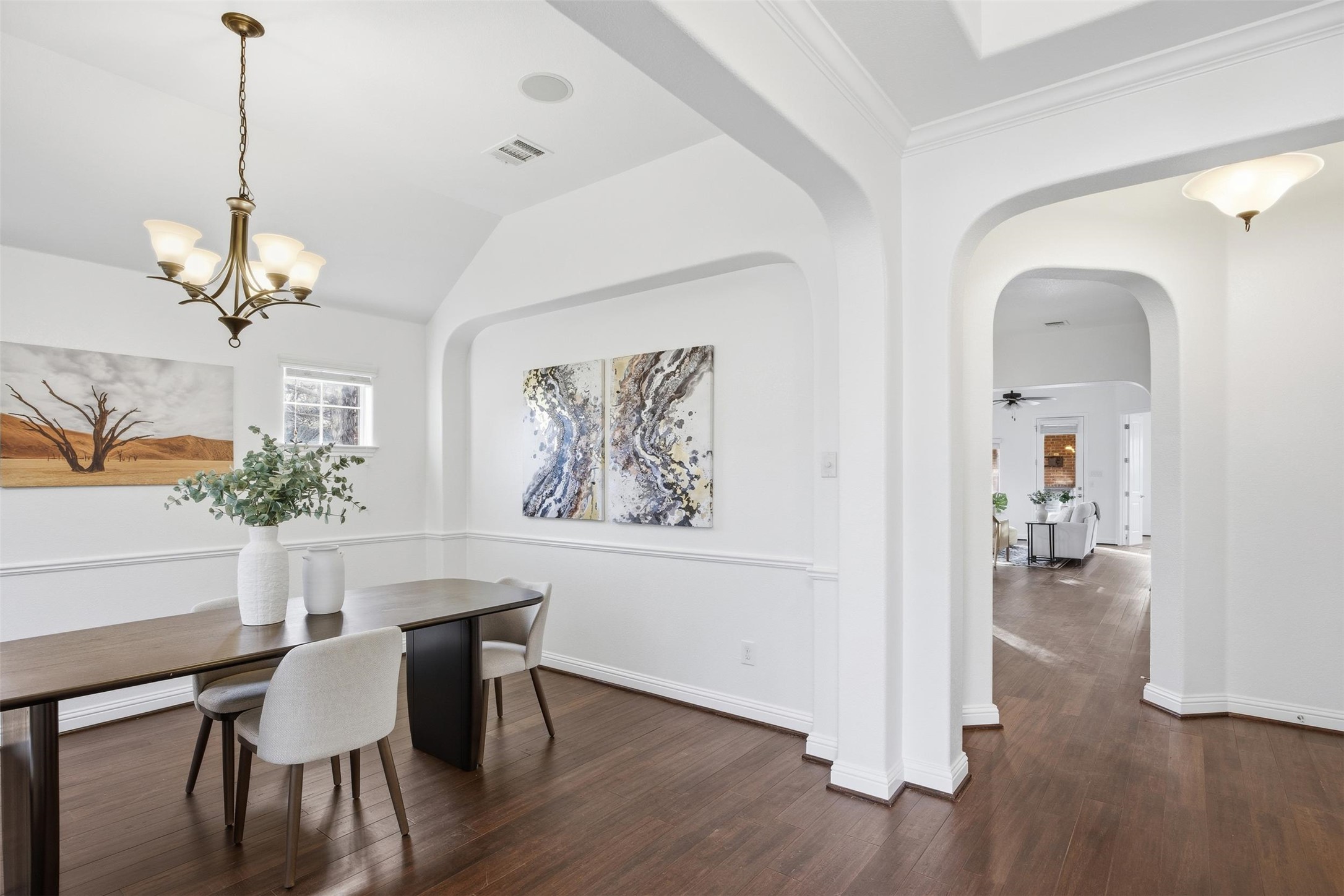 13600 Hymeadow Circle Austin, TX 78729 - Photo 13 of 34 a view of a dining room with furniture wooden floor and chandelier