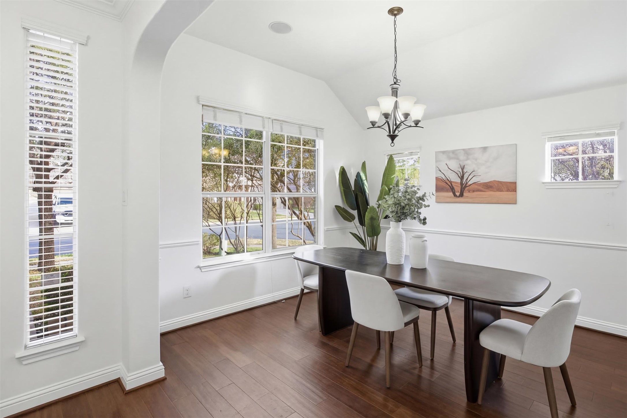 13600 Hymeadow Circle Austin, TX 78729 - Photo 15 of 34 a dining room with furniture potted plants and wooden floor