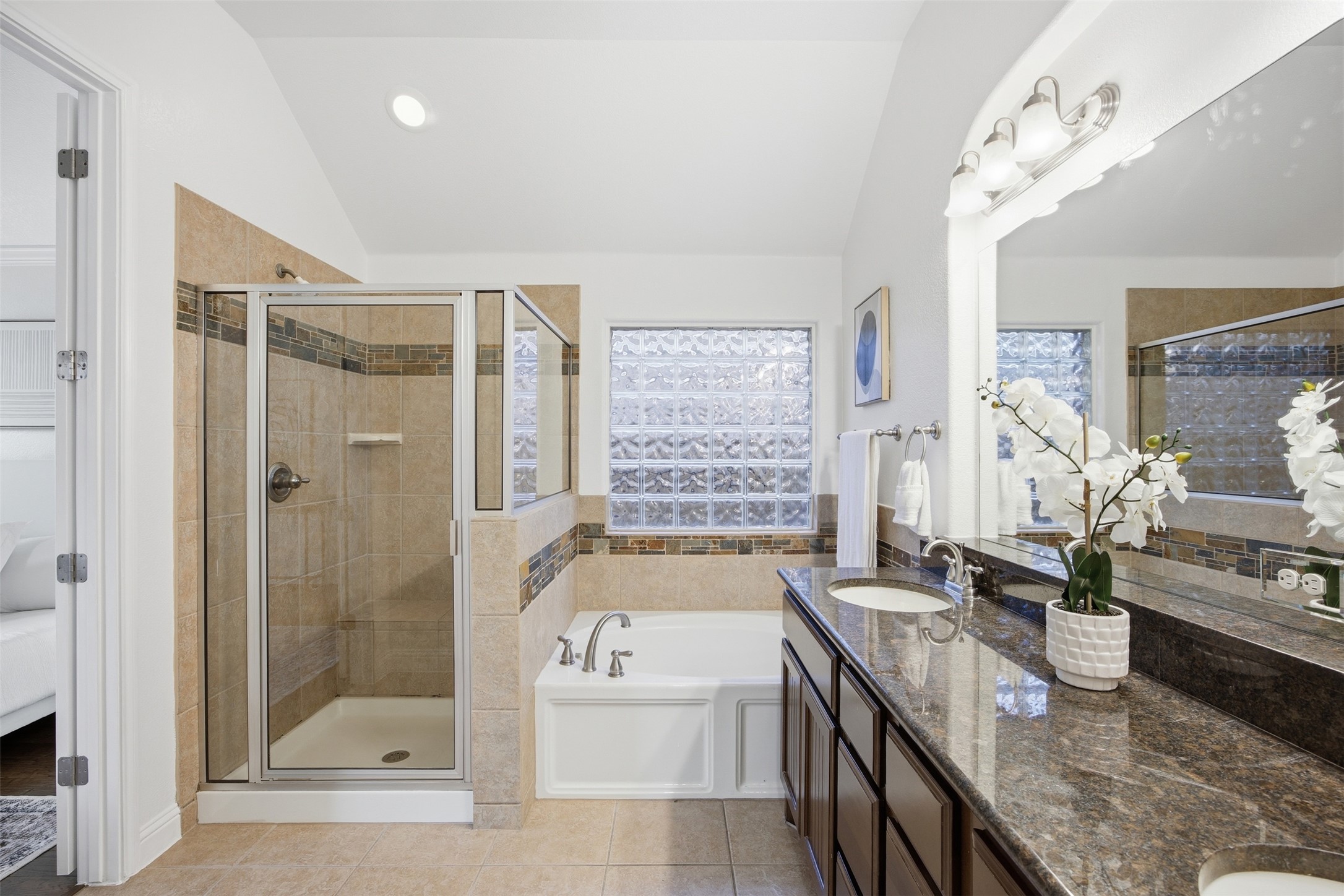 13600 Hymeadow Circle Austin, TX 78729 - Photo 21 of 34 a spacious bathroom with sink shower bathtub and next to a window