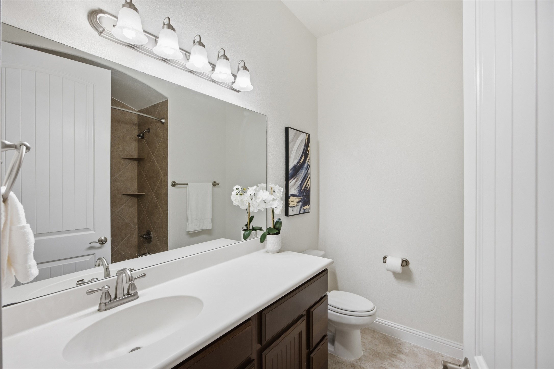 13600 Hymeadow Circle Austin, TX 78729 - Photo 25 of 34 a bathroom with a sink vanity and a mirror