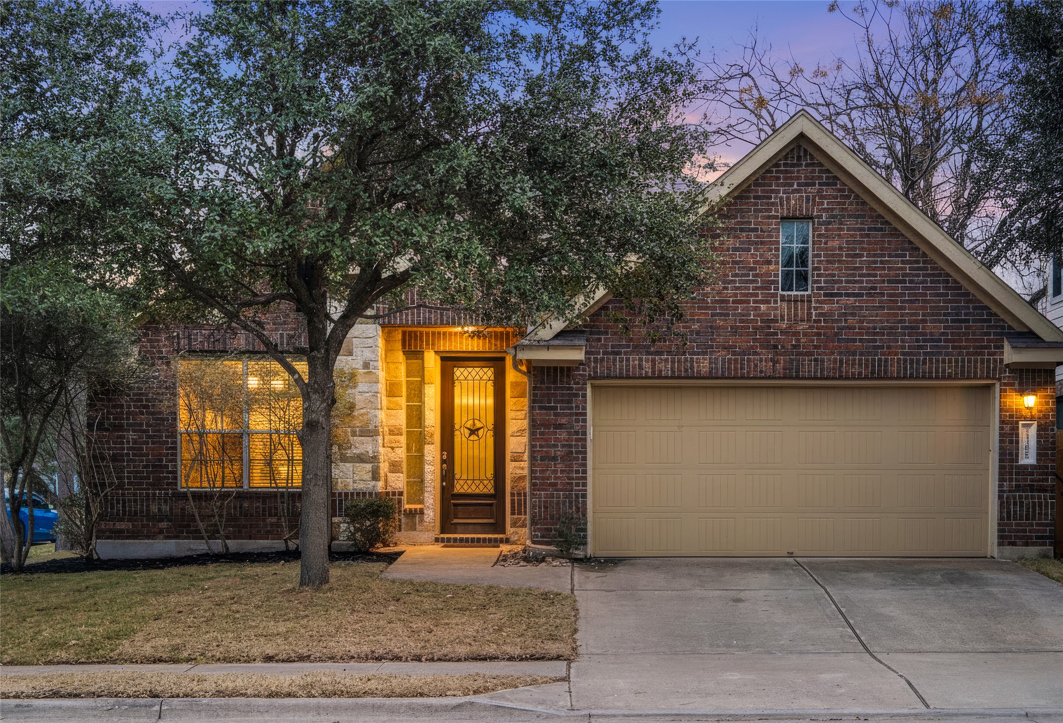 13600 Hymeadow Circle Austin, TX 78729 - Photo 3 of 34 a front view of a house with garden