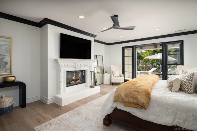 a bedroom with a bed and a fireplace