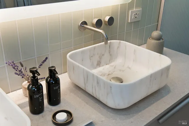 a bathroom with a tub and sink