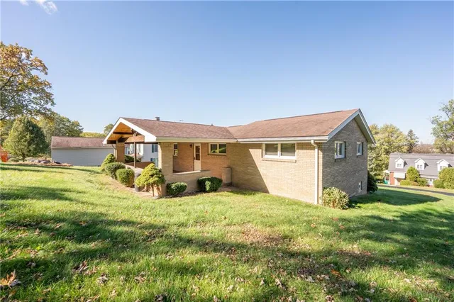 a view of a house with a big yard