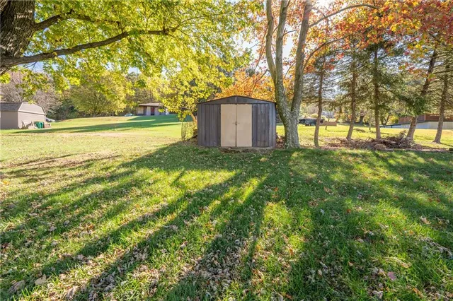 an aerial view of a house with swimming pool garden and patio
