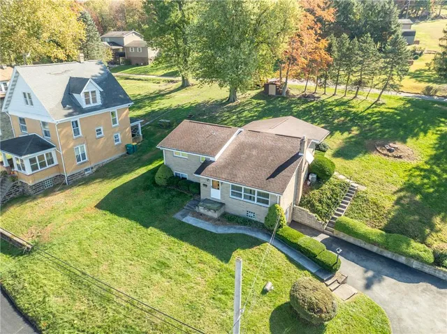 a swimming pool with some trees in the background