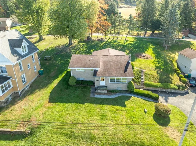 a view of a swimming pool with a garden