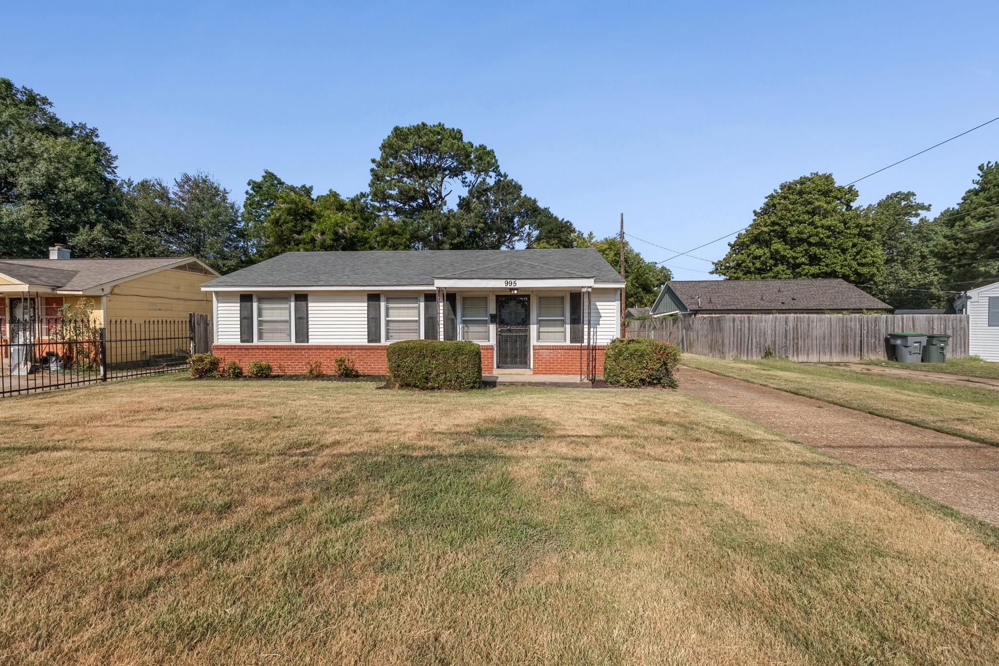 View of front of home featuring brick siding