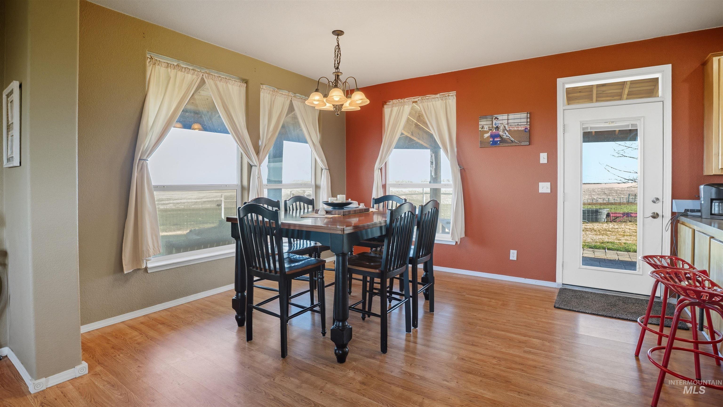 19397 Cloverland Road Asotin, WA 99402 - Photo 7 of 37 Dining room with suspended lighting and light wood-type flooring