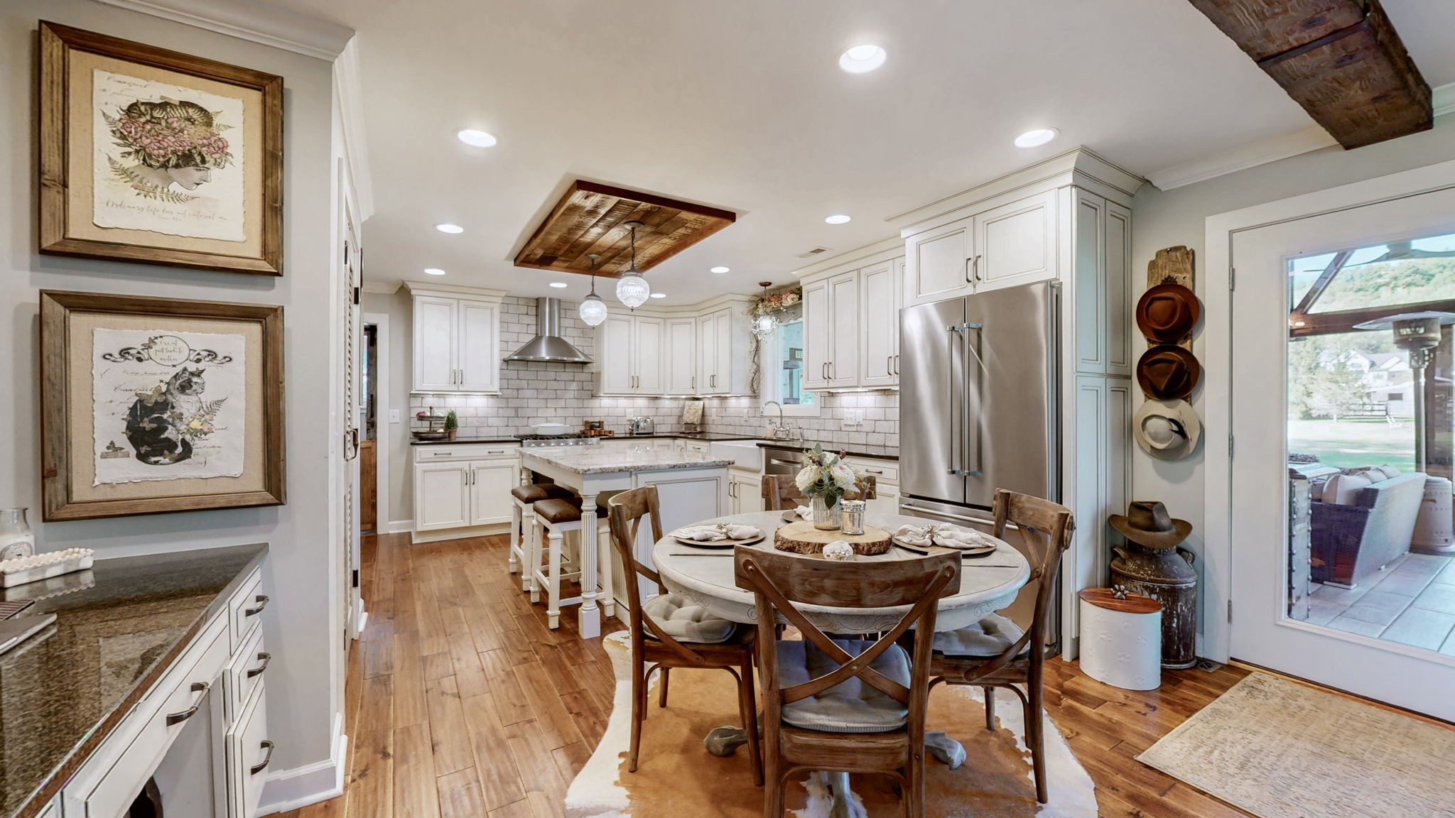 1496 Coleman Road Franklin, TN 37064 - Photo 15 of 82 a dining room with stainless steel appliances kitchen island granite countertop furniture and a kitchen view