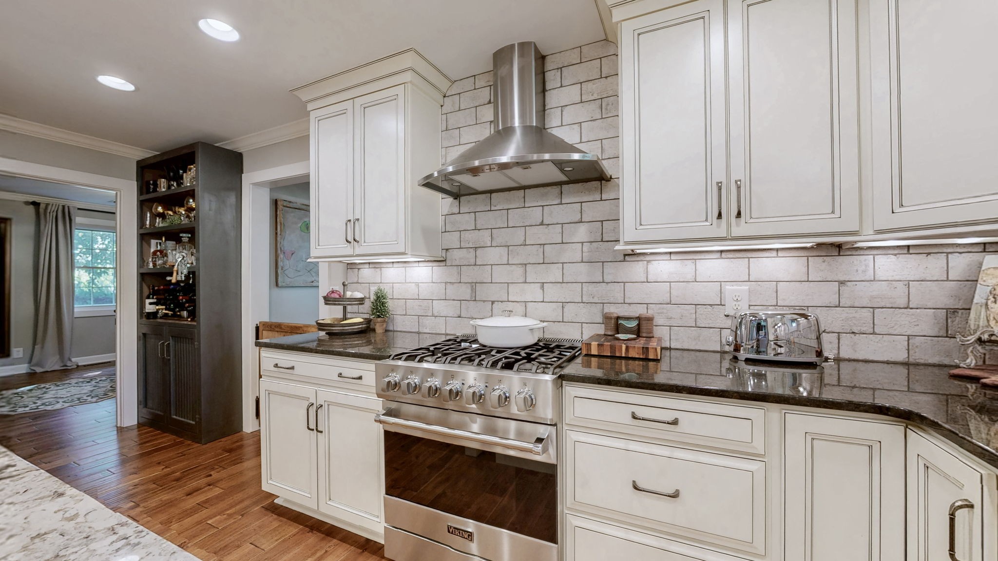 1496 Coleman Road Franklin, TN 37064 - Photo 17 of 82 a kitchen with stainless steel appliances granite countertop a sink a stove and cabinets