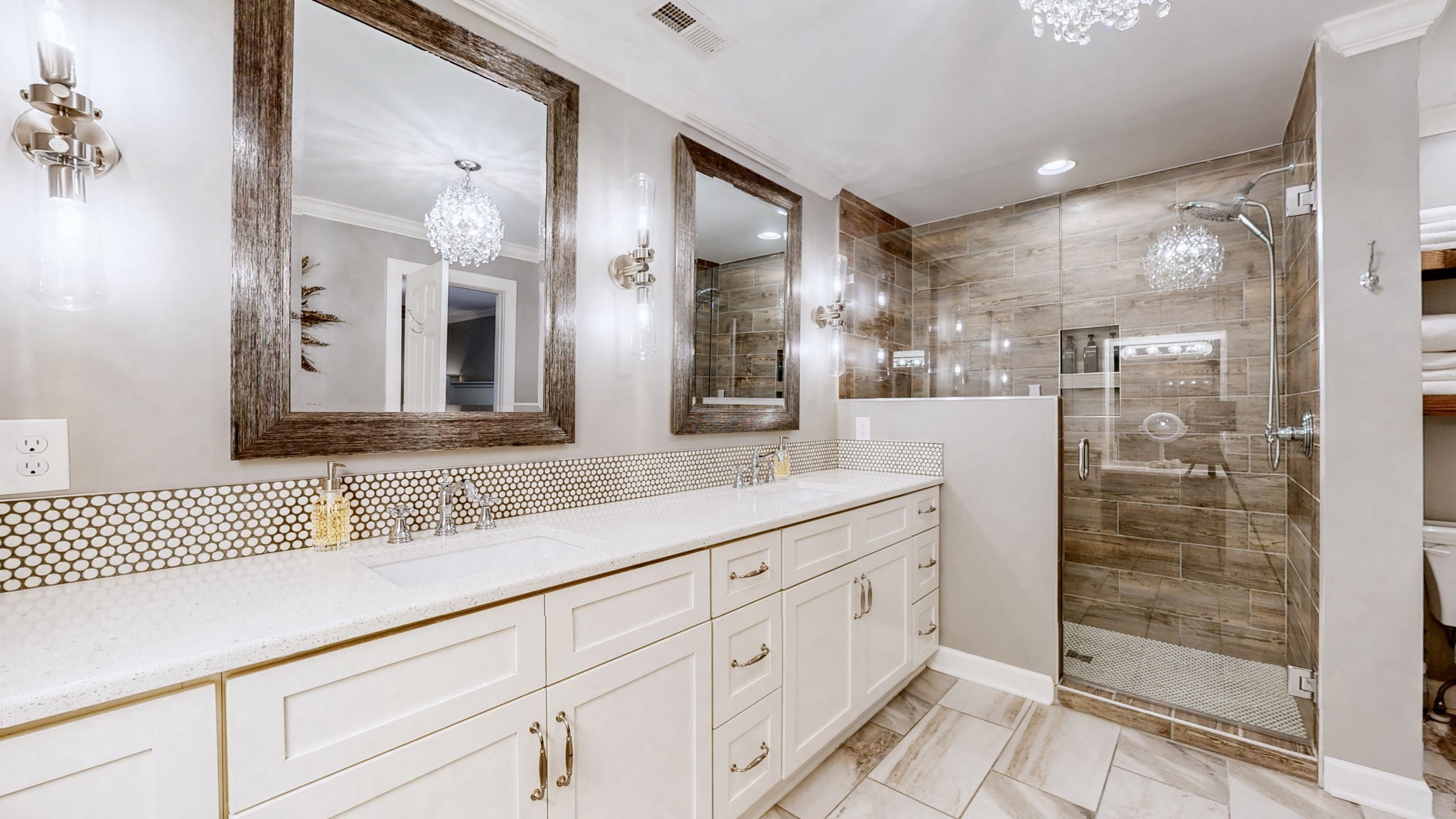 1496 Coleman Road Franklin, TN 37064 - Photo 24 of 82 a bathroom with a shower sink and mirror