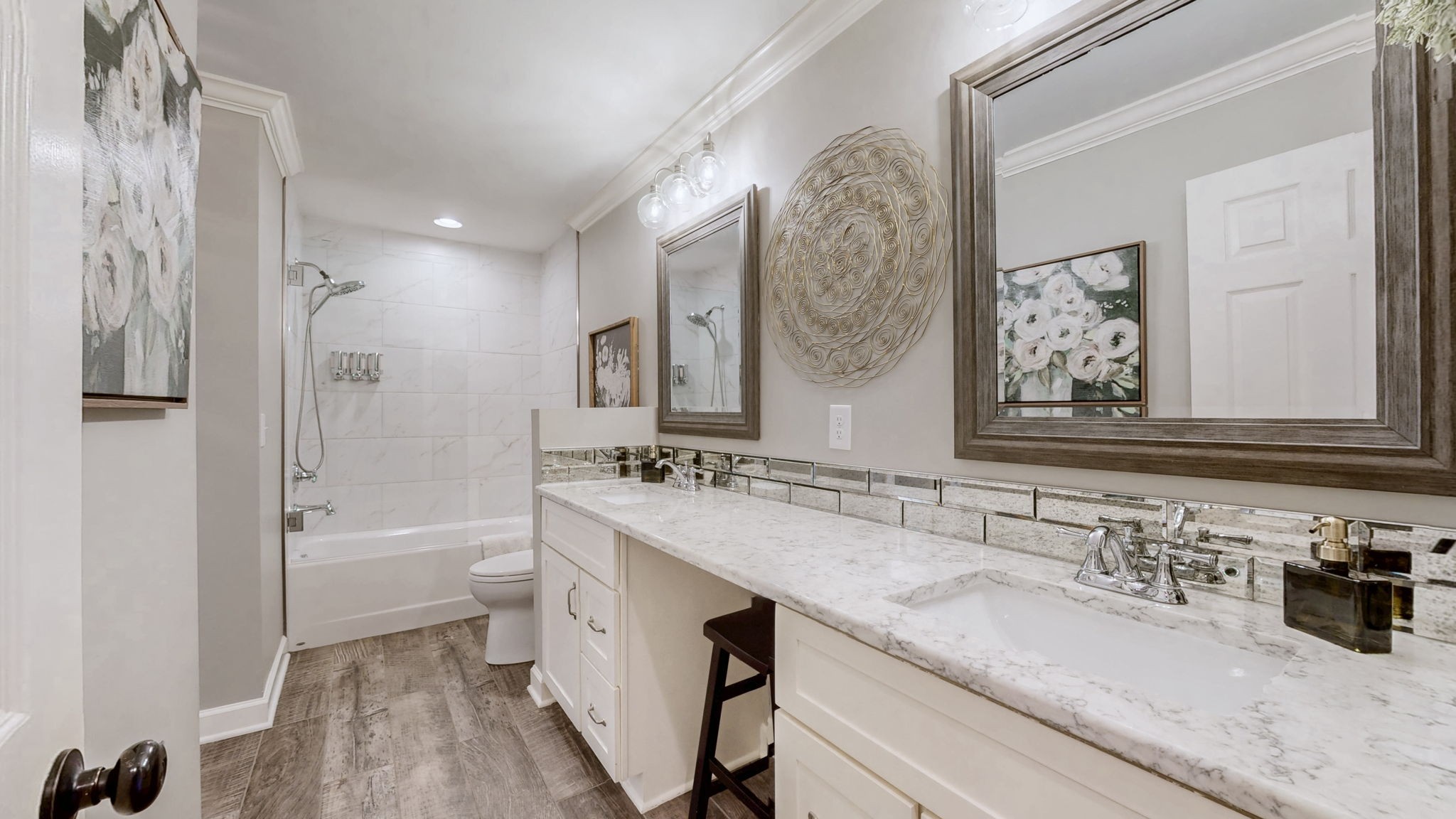 1496 Coleman Road Franklin, TN 37064 - Photo 28 of 82 a bathroom with a granite countertop sink a toilet a mirror and bathtub