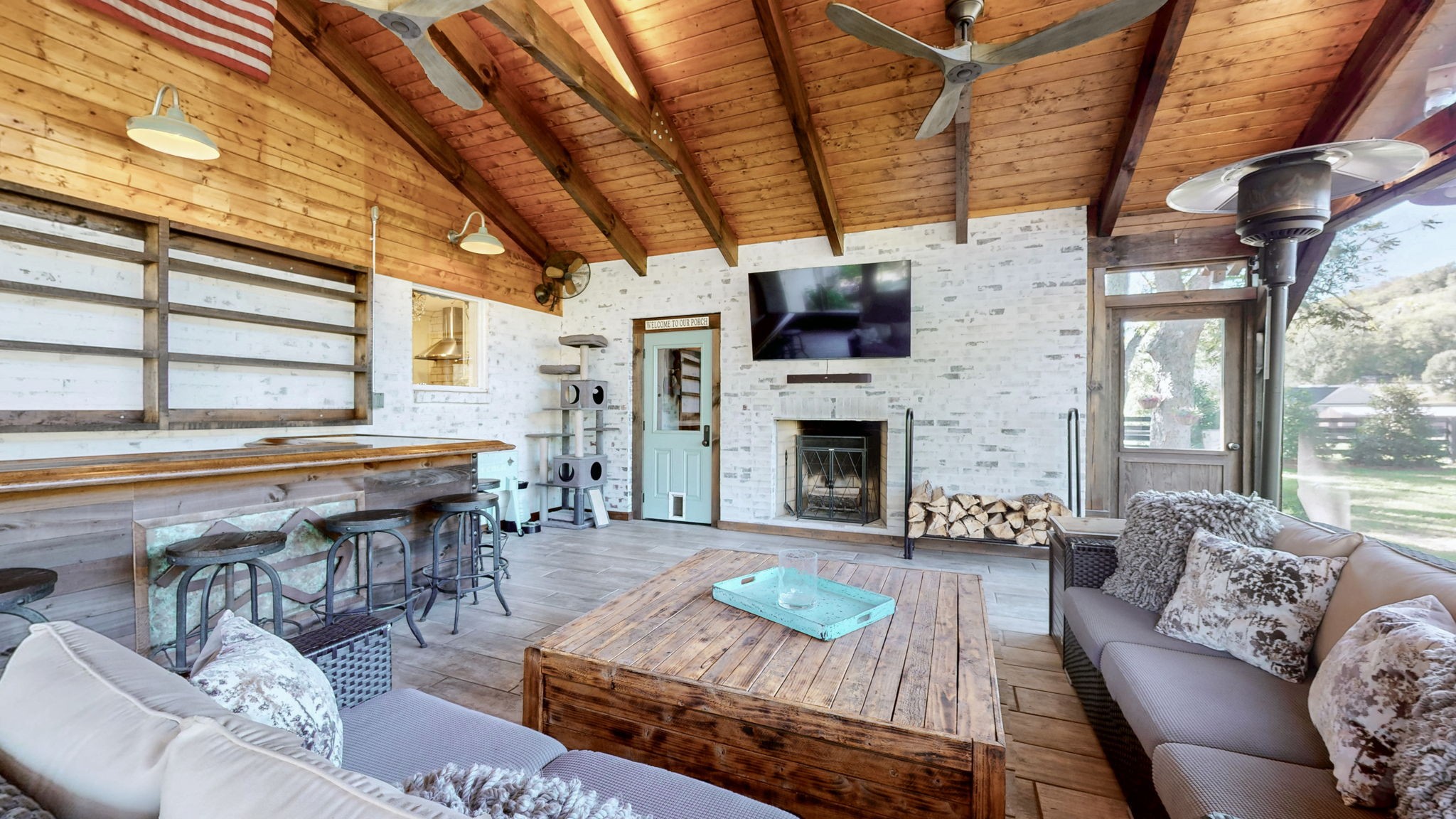 1496 Coleman Road Franklin, TN 37064 - Photo 41 of 82 a living room with furniture a fireplace a flat screen tv and windows
