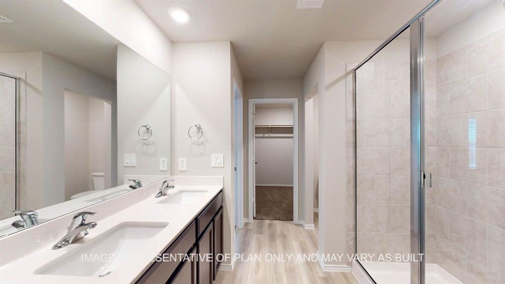 3201 Cyprian Road Lorena, TX 76655 - Photo 17 of 27 a bathroom with a double vanity sink a mirror and a shower