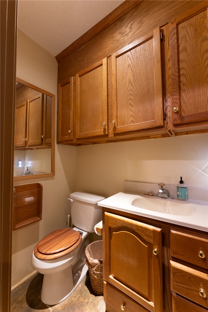 139 Todds Creek Road Central, SC 29630 - Photo 14 of 45 This bathroom features a functional vanity, toilet, and storage cabinets.