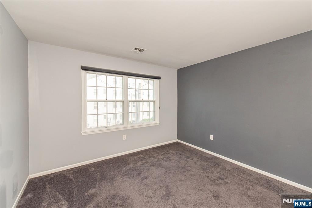 69 Amethyst Lane, Unit 283 Paterson, NJ 07501 - Photo 12 of 20 an empty room with a window